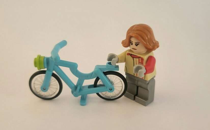 a toy figurine on a bike